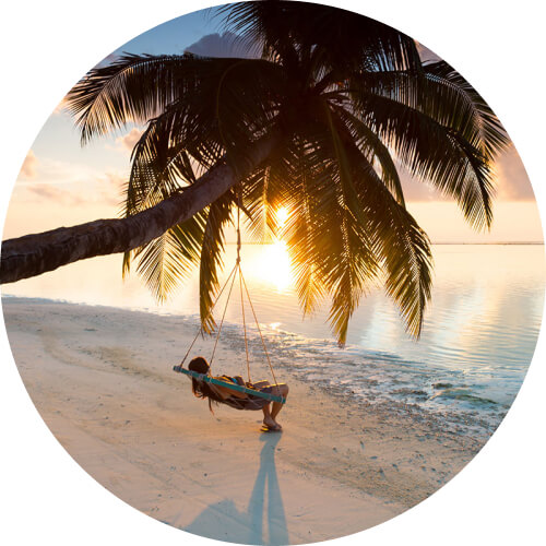 Person relaxing by the beach